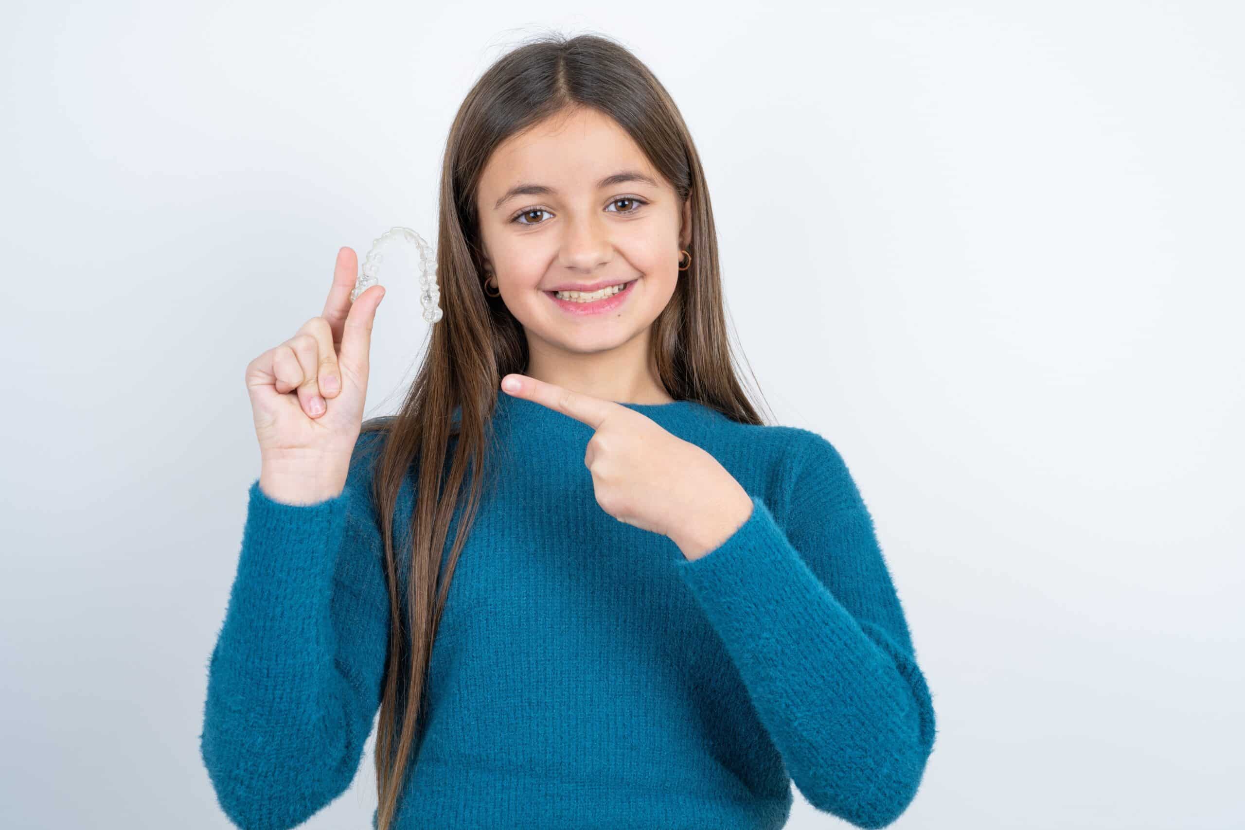A subtle, removable option that gently straightens teeth for older children who prefer alternatives to traditional metal braces.